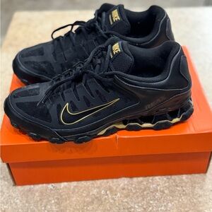 Nike Men's Black Athletic Shoes with Gold Accents